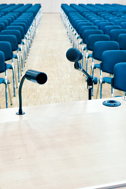 Rednerpult, Speaker`s table Speaker`table- Cross processed with a selective focus on the mic. classroom empty education desk stock pictures, royalty-free photos & images