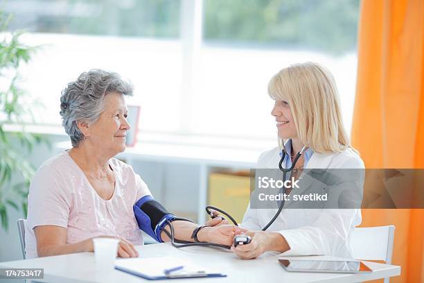 Senior Woman At Doctors Office Stock Photo - Download Image Now - Doctor, Mature Women, Patient