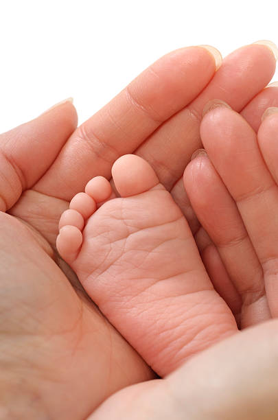 istock Baby foot in female hands 174753652