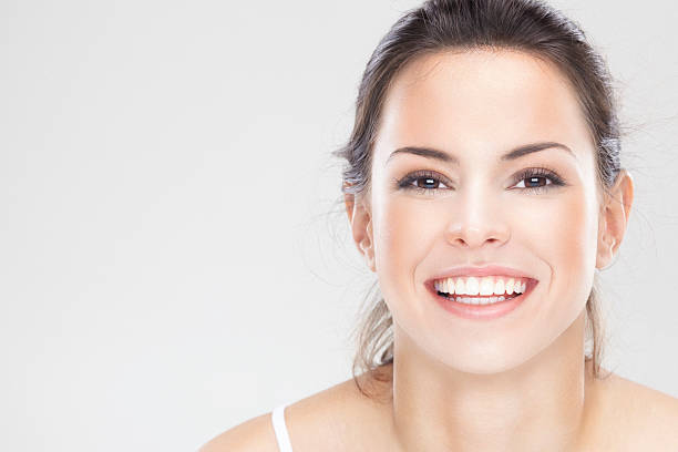 Beauty portrait of a young brunette woman with beautiful smile stock photo