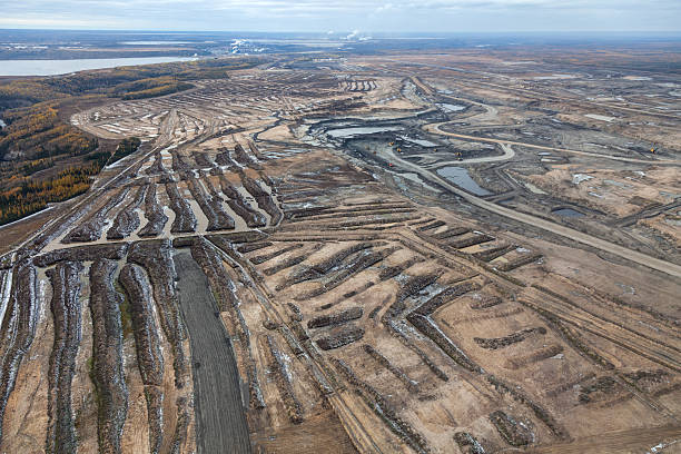 Oilsands Aerial Photo Expansive aerial view of a pit mining project in Alberta's Oilsands near Fort McMurray. oilsands stock pictures, royalty-free photos & images