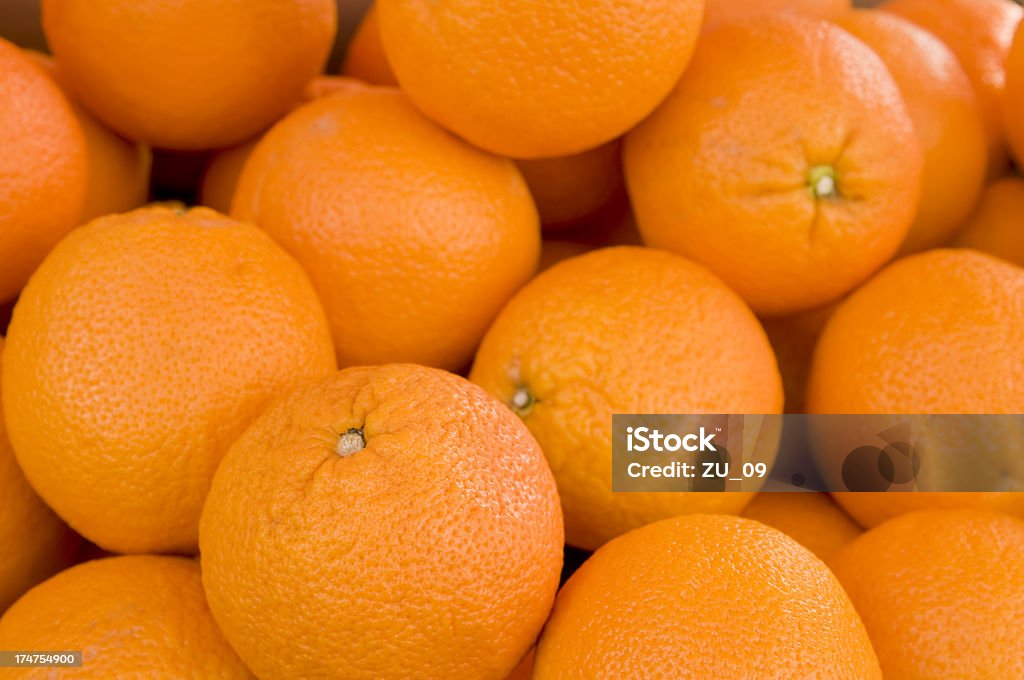 Many fresh oranges at a market stall Valencia Orange Stock Photo