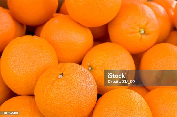 Many Fresh Oranges At A Market Stall Stock Photo - Download Image Now - Valencia Orange, Citrus Fruit, Colored Background