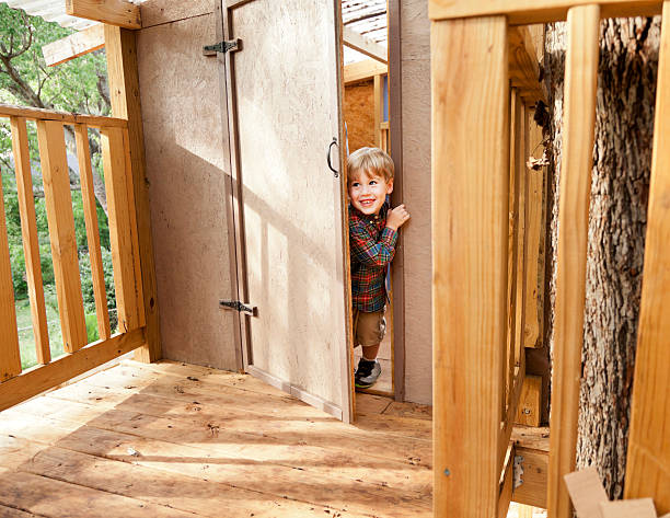 istock Little Boy in a Tree House 174755054