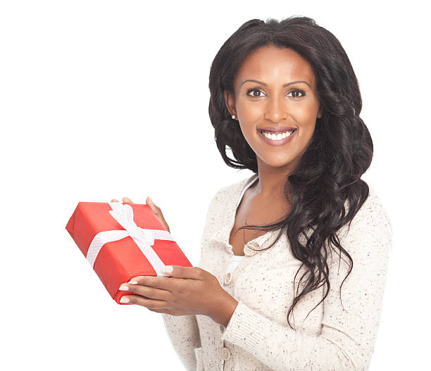istock Beautiful woman holding a gift box 174755962