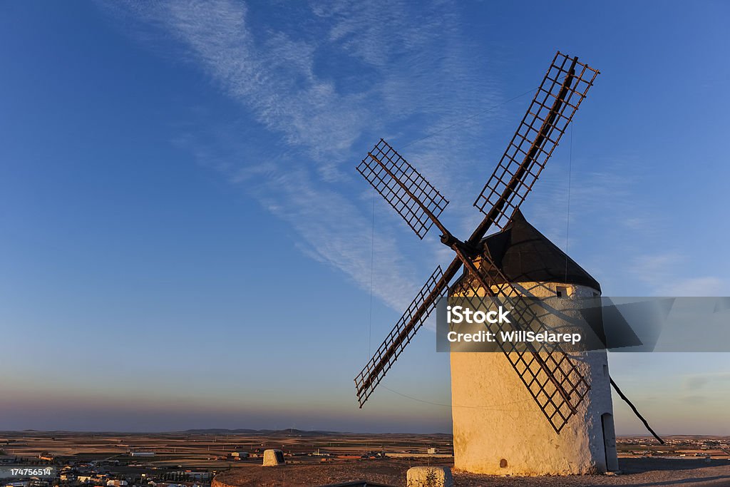 Windmills at sunset, Consuegra, Castilla La Mancha, Spain Windmills at sunset in Castilla La Mancha, Spain Consuegra Stock Photo
