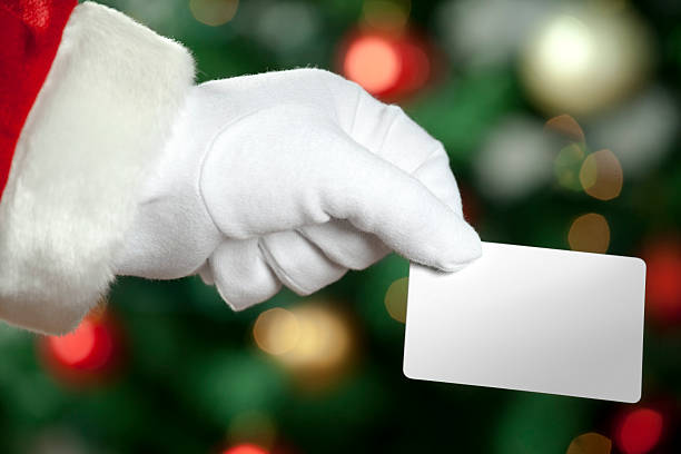 istock Santa Claus giving a blank gift card 174756529