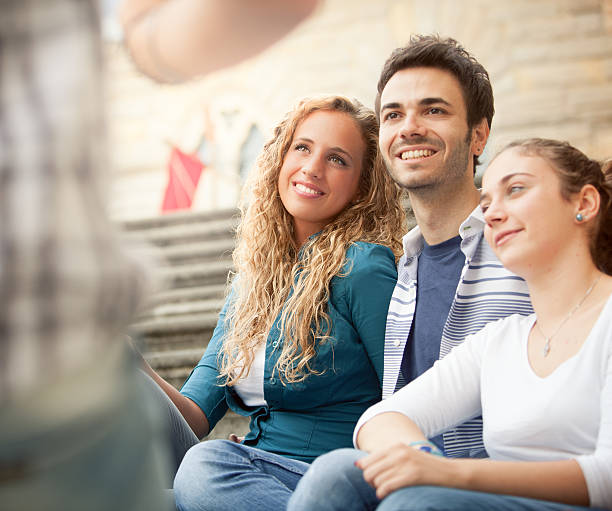 istock Group of friends sitting outside 174756726