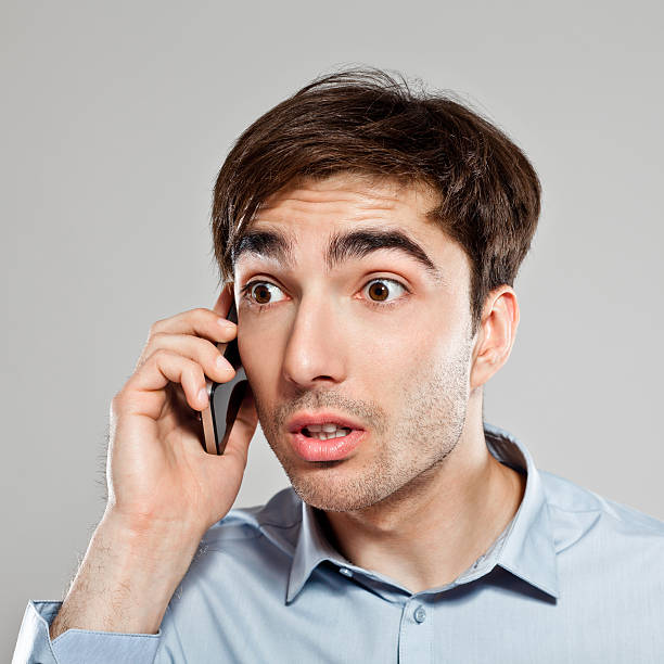 istock Scared Businessman on phone 174757074