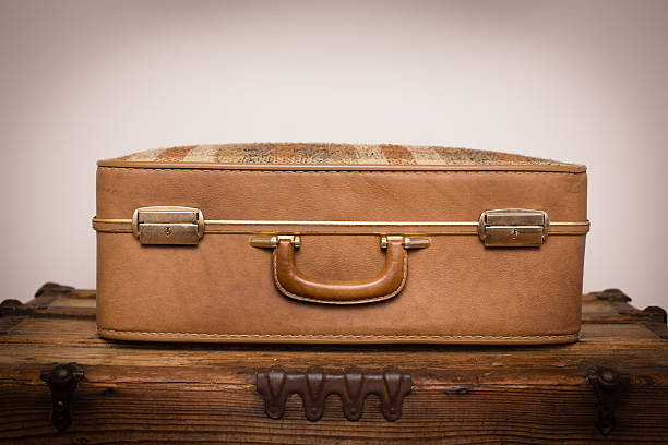 istock Retro Beige and Plaid Suitcase, Sitting on Wood Trunk 174757168