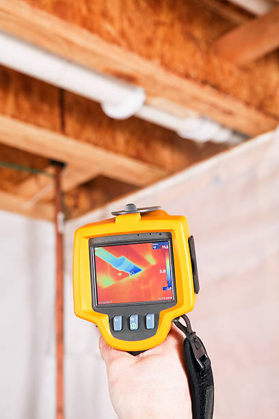 Infrared Thermal Imaging Camera Pointing to Basement Pipe