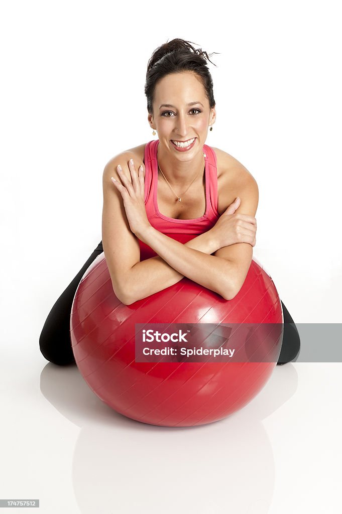 Pillates Instructor Young Caucasian Pilates instructor leaning on exercise ball 20-29 Years Stock Photo
