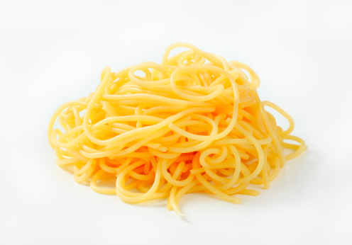 freshly boiled spaghetti on a white background