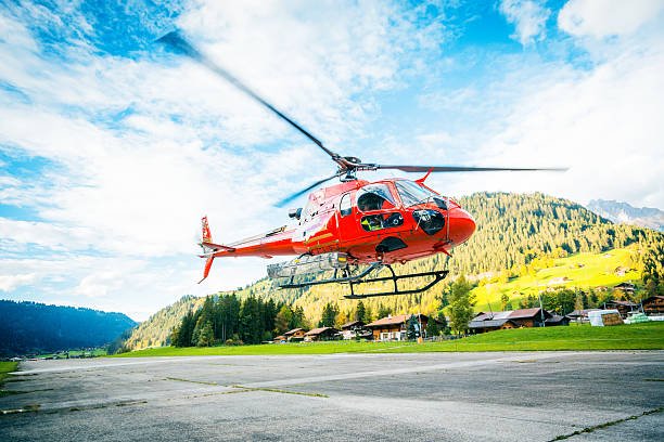 istock red helicopter in the swiss alps 174759045