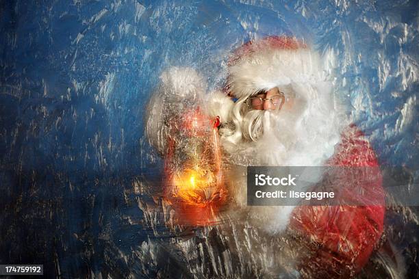 Santa With Lantern In Front Of Frost Window Stock Photo - Download Image Now - Santa Claus, Adult, Canada