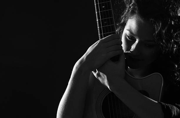 istock Woman with her guitar 174760061