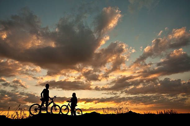 istock Silhouette of Two Children on Bicycles 174760920