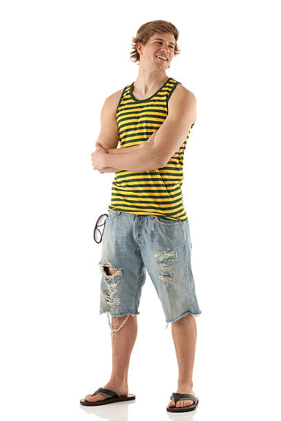 istock Smiling young man standing with his arms crossed 174760992