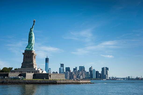 istock Statue of Liberty overlooking NY and Brooklyn Bridge 174761221
