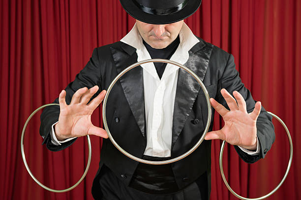 istock Magician performing with rings 174761294