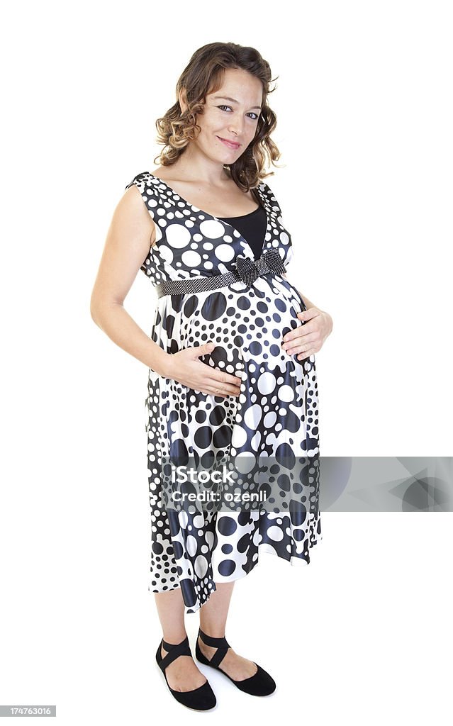 Беременная женщина с руками на живот - Стоковые фото 20-24 года роялти-фри