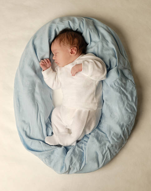 istock A Small Baby Sleeping on a Blue Pillow 174763048