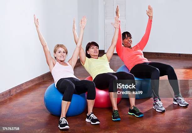 Exercise Class Using Fitness Balls Stock Photo - Download Image Now - 50-59 Years, 60-69 Years, Active Lifestyle