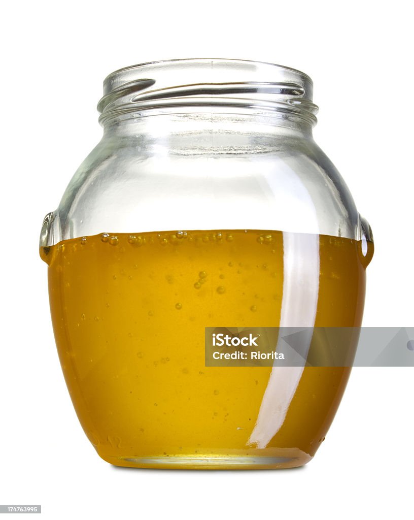 Miel en el recipiente - Foto de stock de Alimento libre de derechos