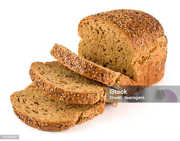 Wholemeal Seeded Brown Bread On A White Background Stock Photo - Download Image Now - Loaf of Bread, Wholegrain, Bread