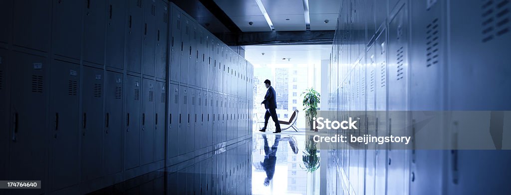 busy working "business concept,a young businessman walking in office." Back Lit Stock Photo