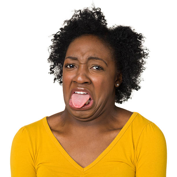 disgusted 若い女性の棒出力端子 - disgust women african ethnicity human face ストックフォトと画像