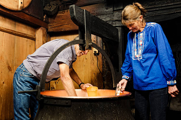 istock Swiss senior cheese makers are working 174765066