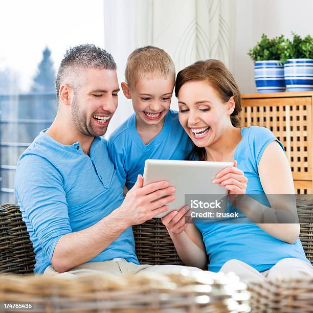Happy Family With Digital Tablet Stock Photo - Download Image Now - 25-29 Years, 30-34 Years, 6-7 Years