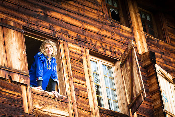 istock young woman looking out at the window 174765874