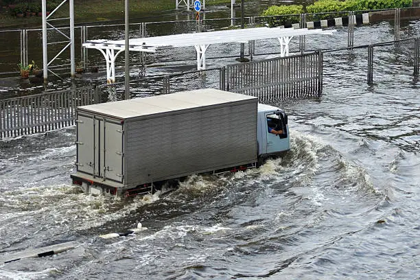 Photo of Driving Car in Flood Water at Bangkok, Thailand