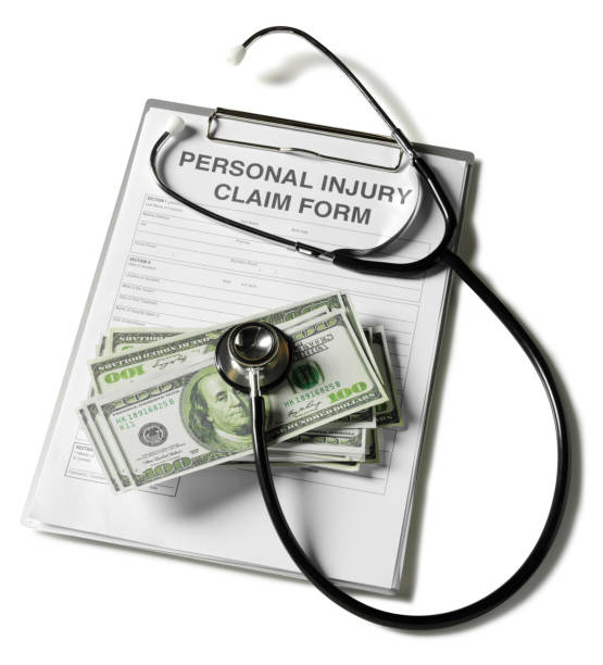 istock Injury Claim Form with American Dollars 174766445