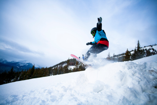 8 years old  snowboarder in the mountain