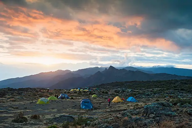 "Sunset at the Shira Camp on Machame route on the ascent of Mount Kilimanjaro. Shira is one of the three volcanic cones of Kilimanjaro, the other ones are Mawenhi and Kibo, which is the actual summit of Mount Kilimanjaro, with 5.895 m Africas highest mountain as well as worlds highest free-standing mountain. See related images:"