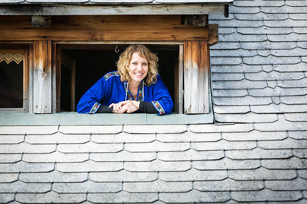 istock young woman looking out at the window 174767021
