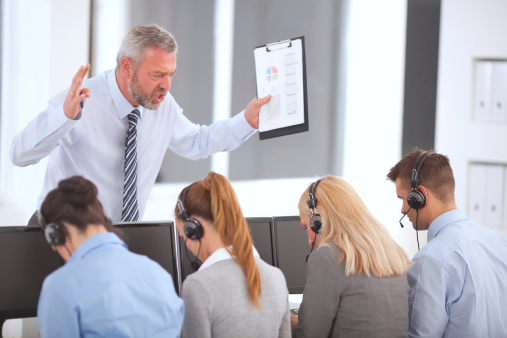 Executive manager yelling at group of customer service operators while working. See more BUSINESS images with this GROUP of PEOPLE. For lightbox click any image below.