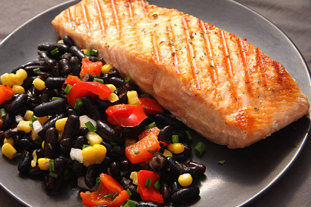 Salmon steak with black beans salad