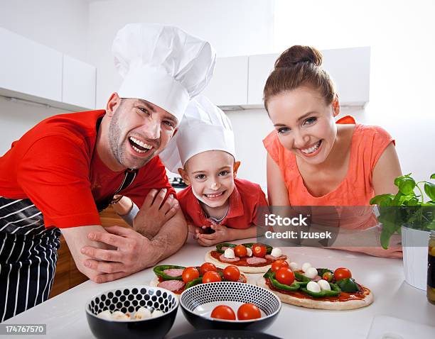 Happy Family Cooking Together Stock Photo - Download Image Now - Close-up, Cooking, Father