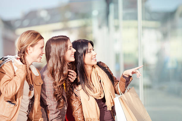 istock Three young women in shopping 174767577