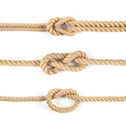 Close-up on three ropes and marine knots isolated on white background. Each is photographed separately.