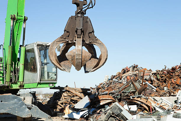 istock Salvage Yard Grappling Claw Near Scrap Pile 174767823