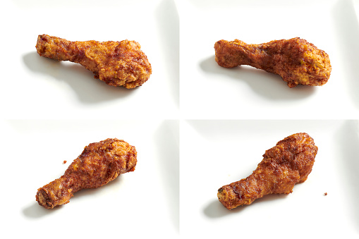 Set of fried chicken drumsticks with sauce in Korean style isolated in white background