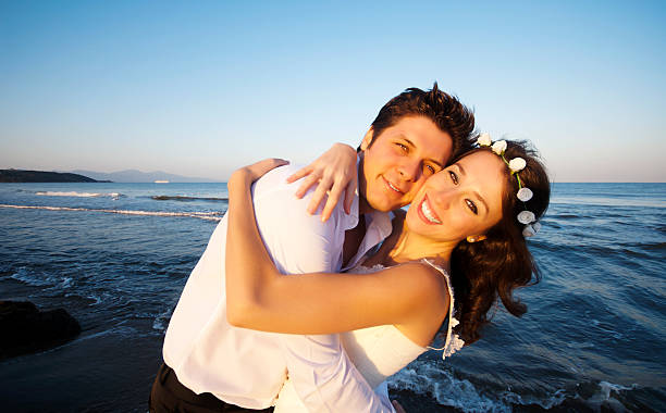 istock Happy newlywed couple on the beach 174768212