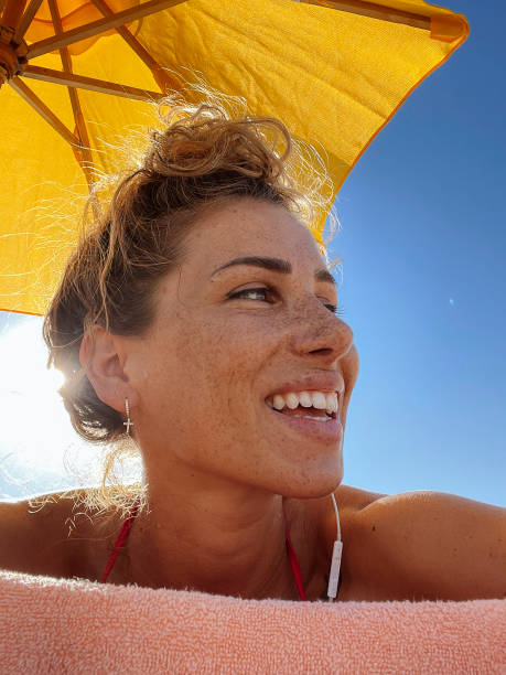 istock Happy woman at the beach 1747682383