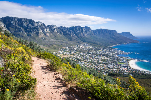 View over Camps Bay in Cape Town from footpath on Lion's Head Mountain.