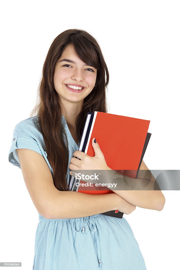 Young Female Student Smiling female student holding books in her hand against white White Background Stock Photo